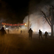 Protesters run away after police deploy tear gas during a demonstration Nov. 24, 2014, in Ferguson, Mo.
Justin Sullivan/Getty Images